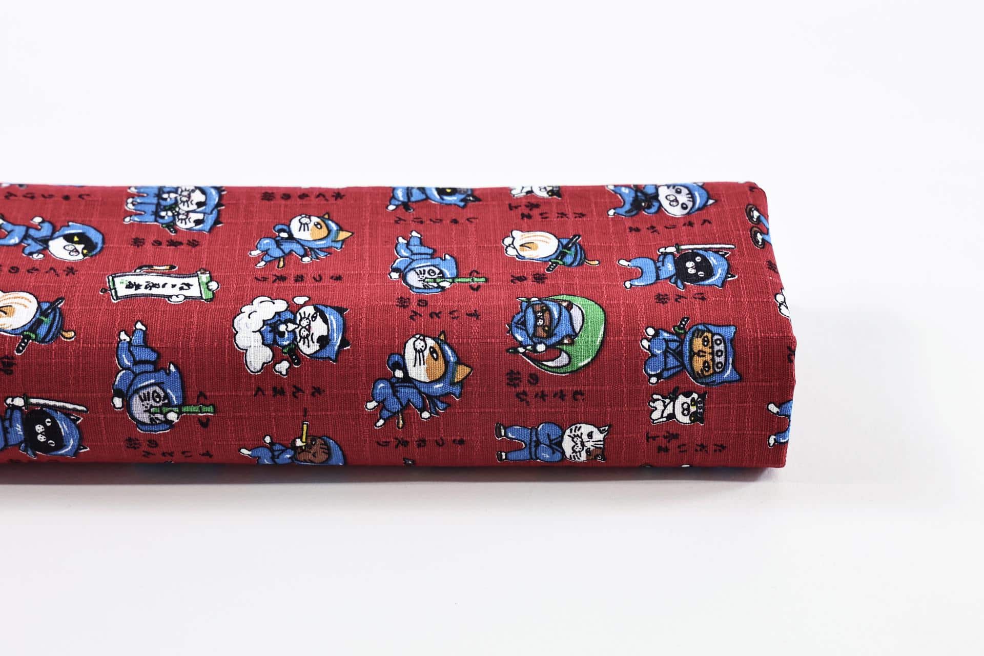 Japanese Neko Ninja fabric on red