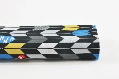 Japanese arrow feather yagasuri fabric graphic on a black background