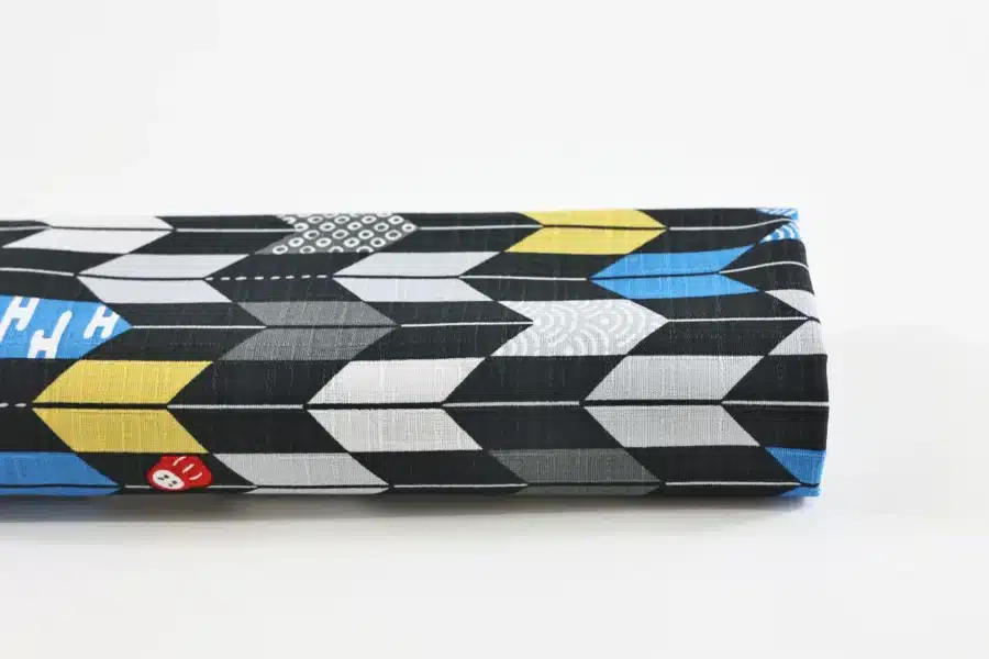 Japanese arrow feather yagasuri fabric graphic on a black background
