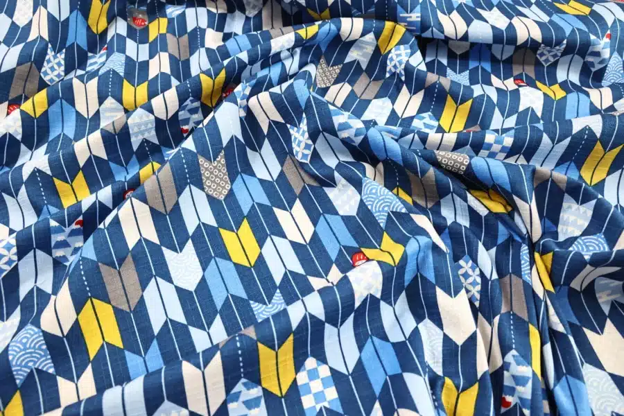 Japanese arrow feather yagasuri fabric in tonal indigo blue, crumpled flat