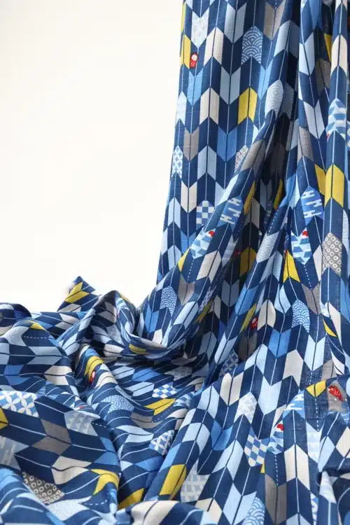 Japanese arrow feather yagasuri fabric in tonal indigo blue, draped
