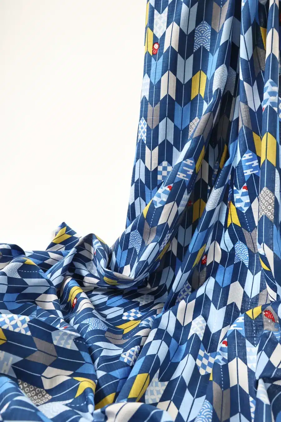 Japanese arrow feather yagasuri fabric in tonal indigo blue, draped