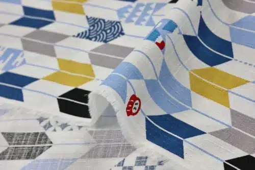 Japanese arrow feather yagasuri fabric multicolor on a white background, fold with selvedge and reverse side