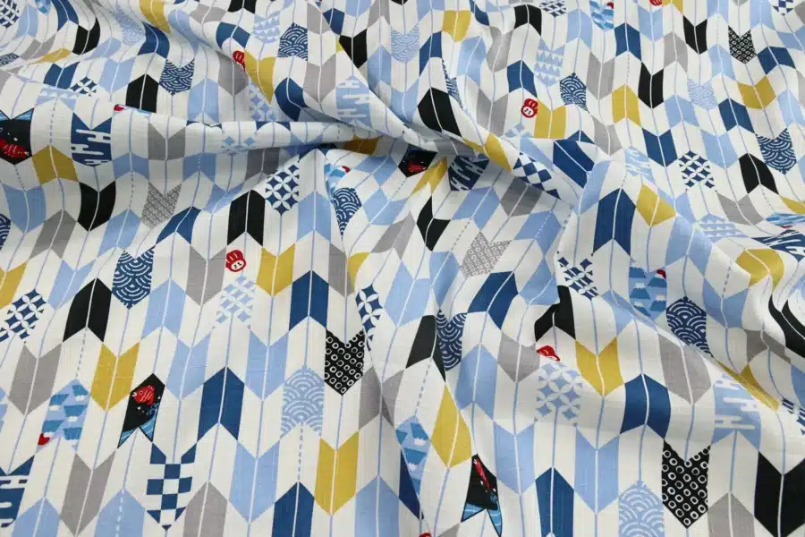 Japanese arrow feather yagasuri fabric multicolor on a white background, crumpled flat