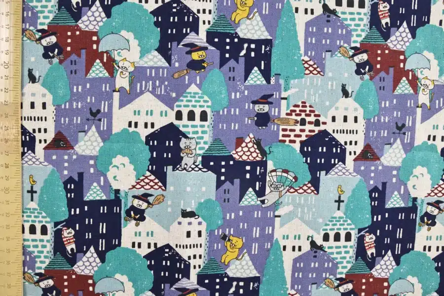 Japanese witch cat village fabric blue, Kobayashi cotton and linen canvas, flat view with ruler