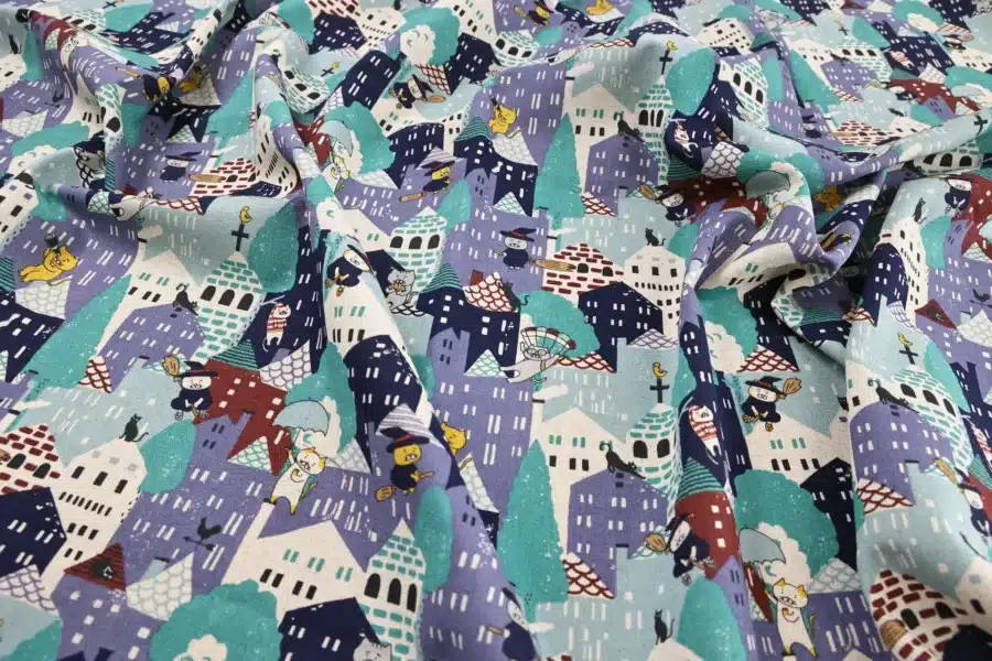Japanese witch cat village fabric blue, Kobayashi cotton and linen canvas, draped flat