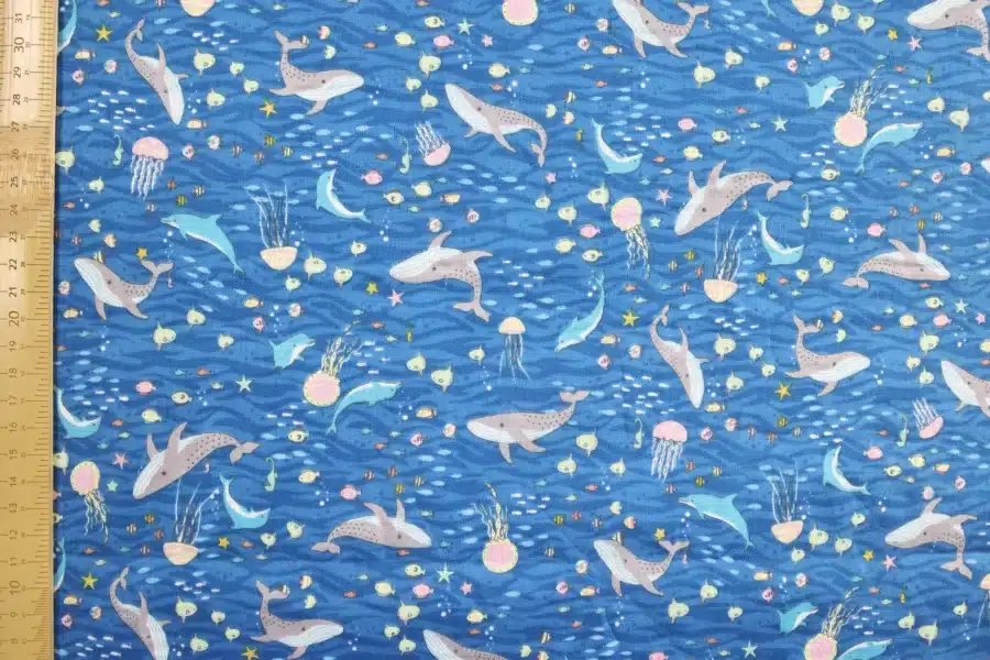 Japanese double gauze whale and dolphin fabric blue background, flat with ruler