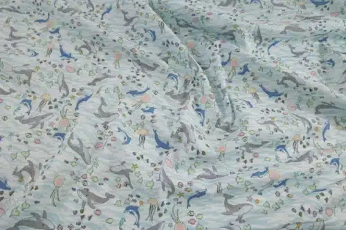 Japanese double gauze whale and dolphin fabric white background, crumpled flat