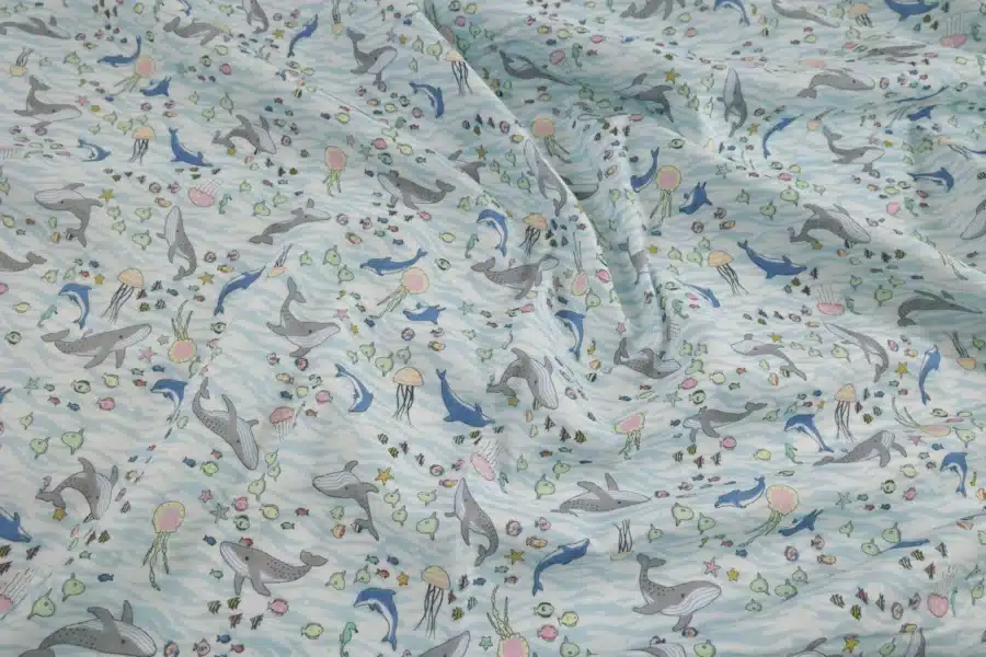 Japanese double gauze whale and dolphin fabric white background, crumpled flat