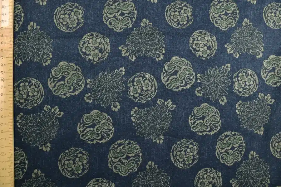 Japanese hanamaru floral medallions fabric navy blue background, flat with ruler